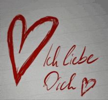 a red heart with the words ich liebe dich below it