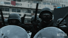 a netflix ad shows a group of soldiers holding batons
