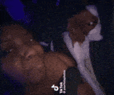 a tiktok video of a person licking a dog 's nose