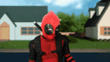 a man in a deadpool costume with a backpack