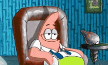 patrick star from spongebob squarepants is sitting in a chair in a room .