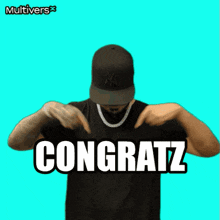 a man wearing a ny hat and a necklace says " congratz "