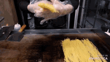 a person is cooking noodles on a stove and the words made in animatica are visible