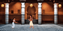 a man and a woman are dancing in a room surrounded by columns .