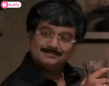 a man with glasses and a mustache is holding a glass of water .