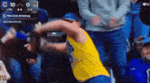 a man in a yellow shirt with the number 8 on it