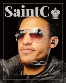 a man wearing sunglasses and ear buds is on a poster that says saintco