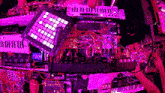 a bunch of electronic devices are stacked on top of each other in a room .