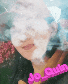 a woman in a pink hat is surrounded by smoke and the name jo-quilm is visible
