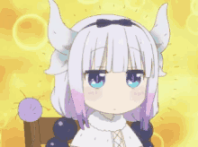 a girl with horns is sitting in a chair with a yellow background .