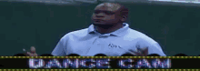 a man is dancing under a dance cam sign