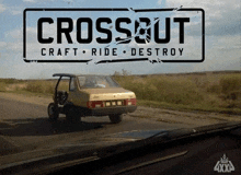 a sign that says crossout craft ride destroy with a car in the background