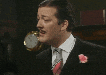 a man wearing a suit and tie says men are such bastards