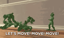 a group of toy soldiers are standing on a wooden table and the words let 's move ! move ! move !