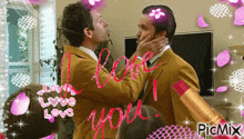 a picture of two men kissing with the words " i love you " written in red