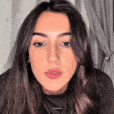 a close up of a woman 's face with the words zeudgifs written on the bottom