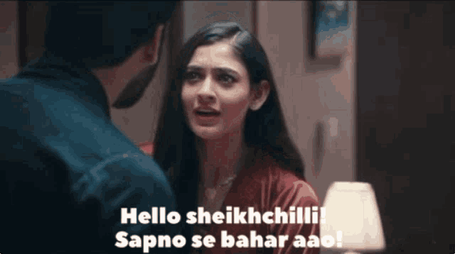 a man and a woman are looking at each other and the woman says hello sheikhchilli