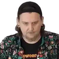 a man wearing a black hat and a shirt that says oween