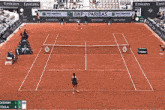 a tennis court with emirates and bnp paribas ads on the walls