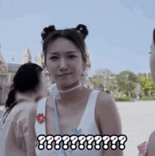 a woman in a white tank top has a choker around her neck and says " ?? "