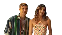 a man and a woman are standing next to each other on a white background . the woman is wearing a halter top .