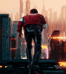 a man in a red jacket stands in front of a futuristic city with the words mj the snowman below him