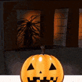 a pumpkin with a face on it is sitting on a table