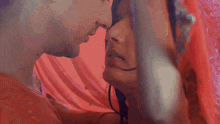 a man and a woman are looking into each others eyes