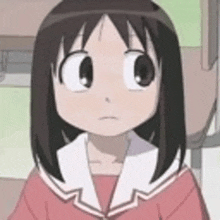 a close up of a cartoon girl in a school uniform .