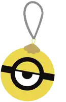 a yellow object with a black circle on it is hanging from a string