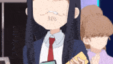 a girl with long black hair and a red tie is holding a yellow card