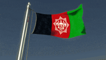 the flag of afghanistan flies in the wind