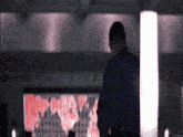 a man is standing in front of a screen that says ' imovie.net ' on it