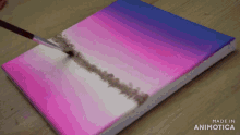 a painting is being painted on a canvas with the words made in animotica on the bottom