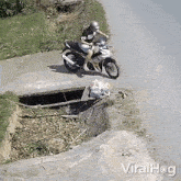Falls Down From A Motorcycle Viralhog GIF - Falls Down From A Motorcycle Viralhog Falls Down The Hole GIFs