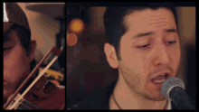 a man playing a violin and singing into a microphone