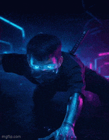 a man with a mask on his face is holding a sword in a dark room