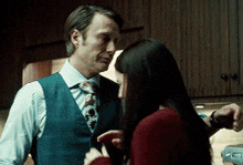 a man and a woman are standing next to each other