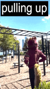 a poster for pulling up shows a person standing in a park