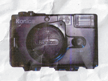 a picture of a konica camera is on a piece of paper