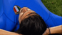 a man in a blue shirt with a patch that says italia on it