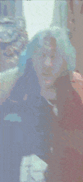 a blurry picture of a person with blue hair and a choker