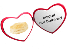 a heart shaped mirror that says biscuit our beloved on it