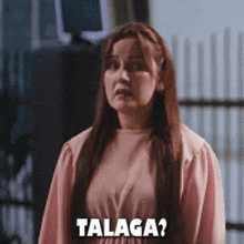 a woman in a pink dress is saying talaga