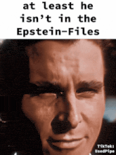 a picture of a man with a caption that says at least he isn 't in the epstein-files