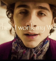 a close up of a man 's face with the words " when i wonk my will " written above him