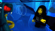 a lego character standing next to a snake in a blue room