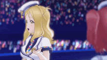 a girl with blonde hair is wearing a sailor outfit
