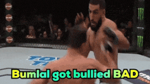 two men fighting in a ring with the words bumlal got bullied bad