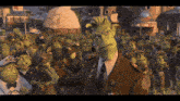 a man in a military uniform stands in front of a crowd of green monsters